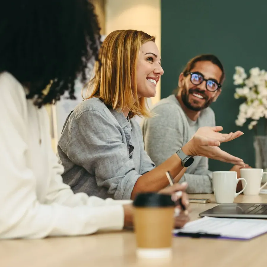 Young business managers and contributors participate in team meeting